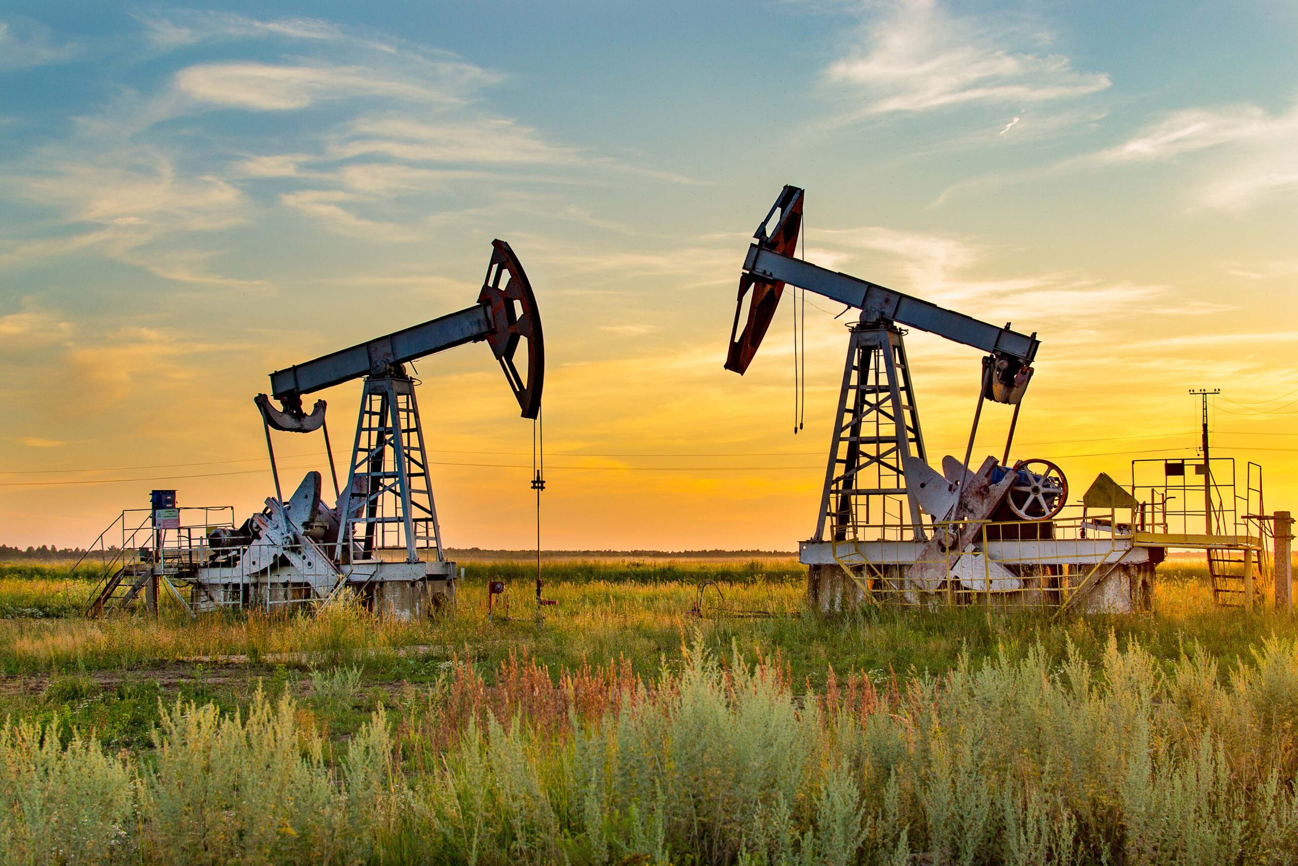 Twin oil and gas pumps in the Permian Basin